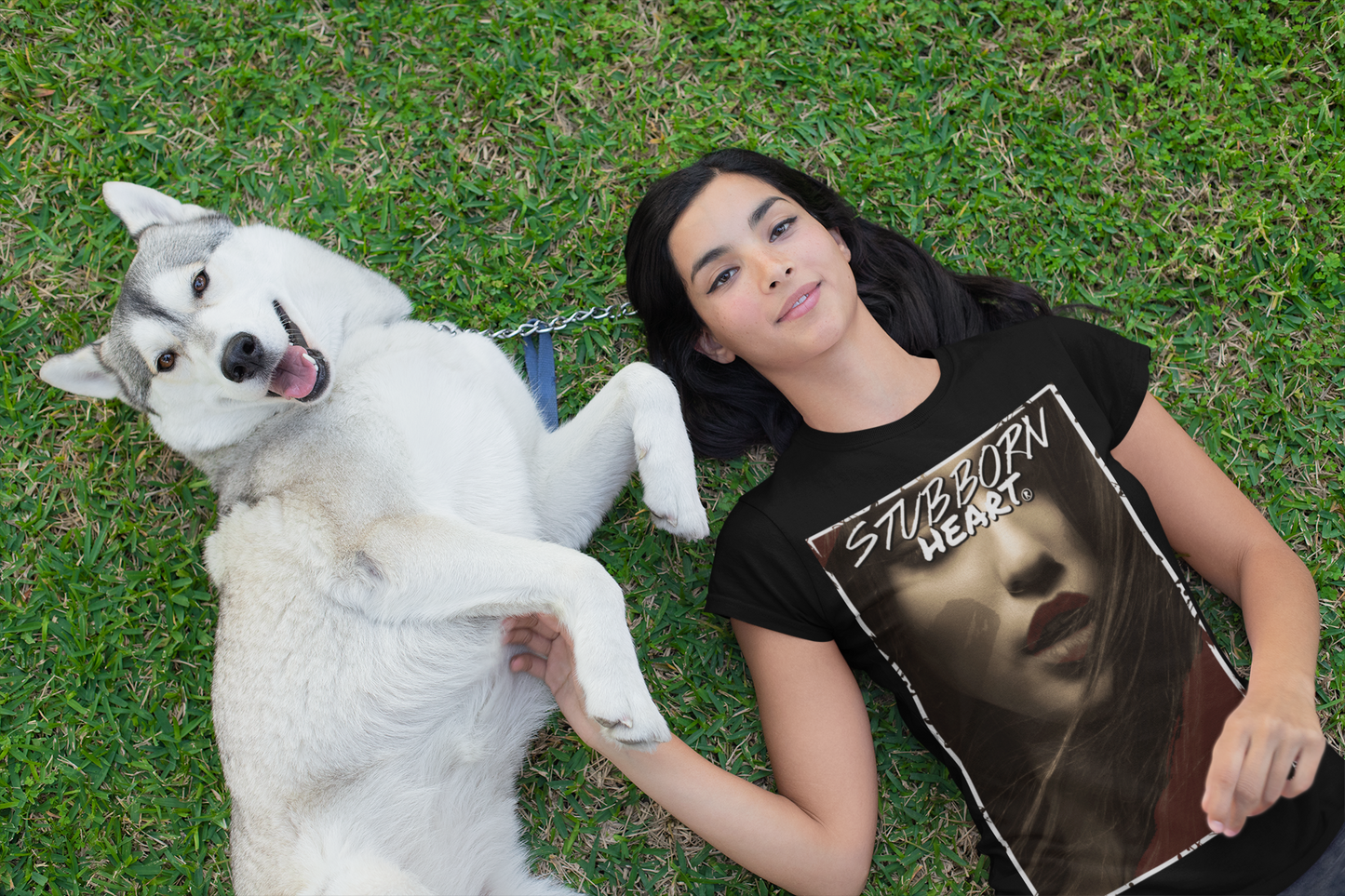 t-shirt-mockup-of-a-woman-lying-on-the-grass-with-her-dog-30660 wearing a femme fatale tee from STUBBORN HEART