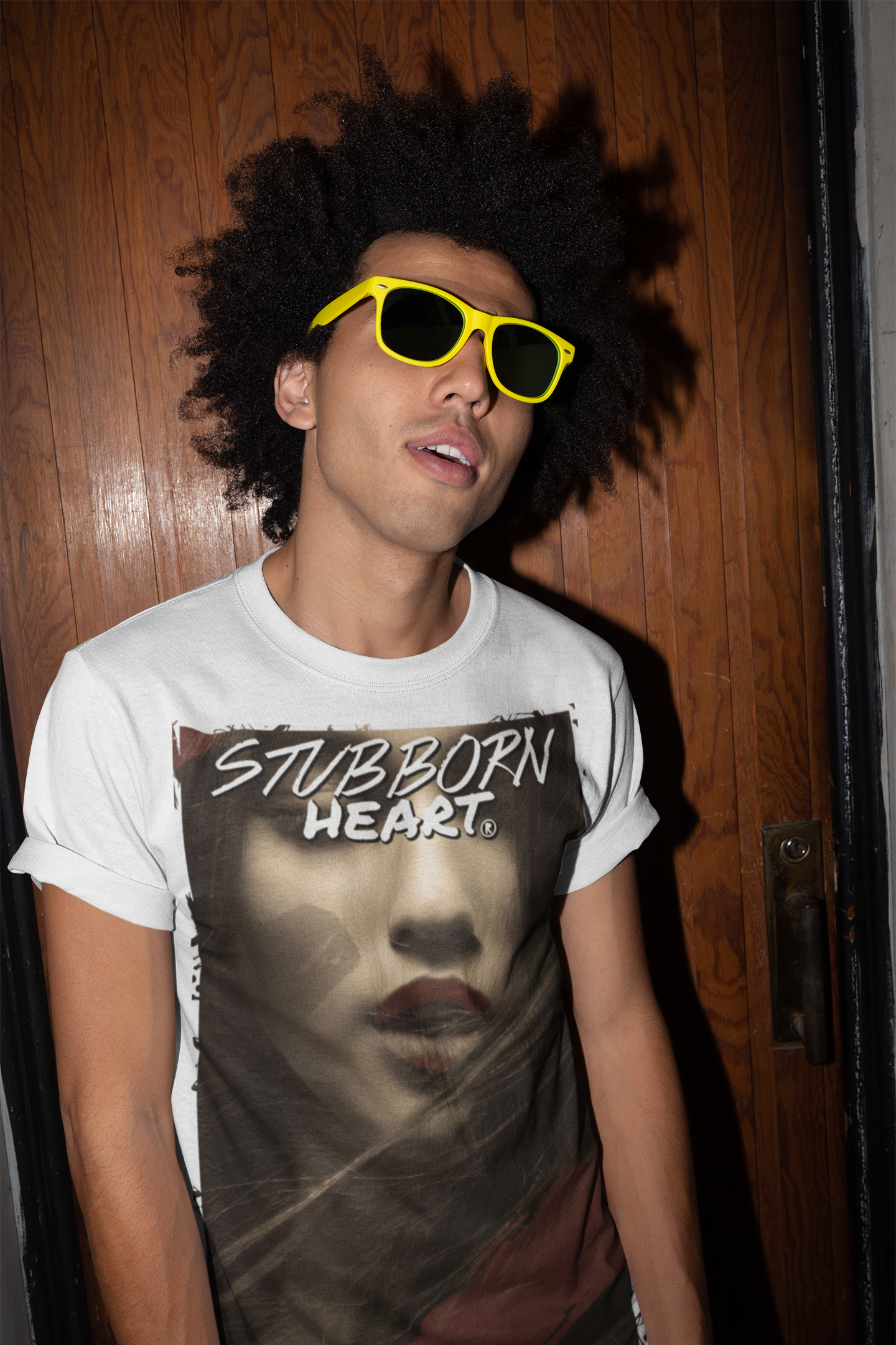 Mixed race male model promoting a femme fatale tshirt design and product made by STUBBORN HEART Apparel