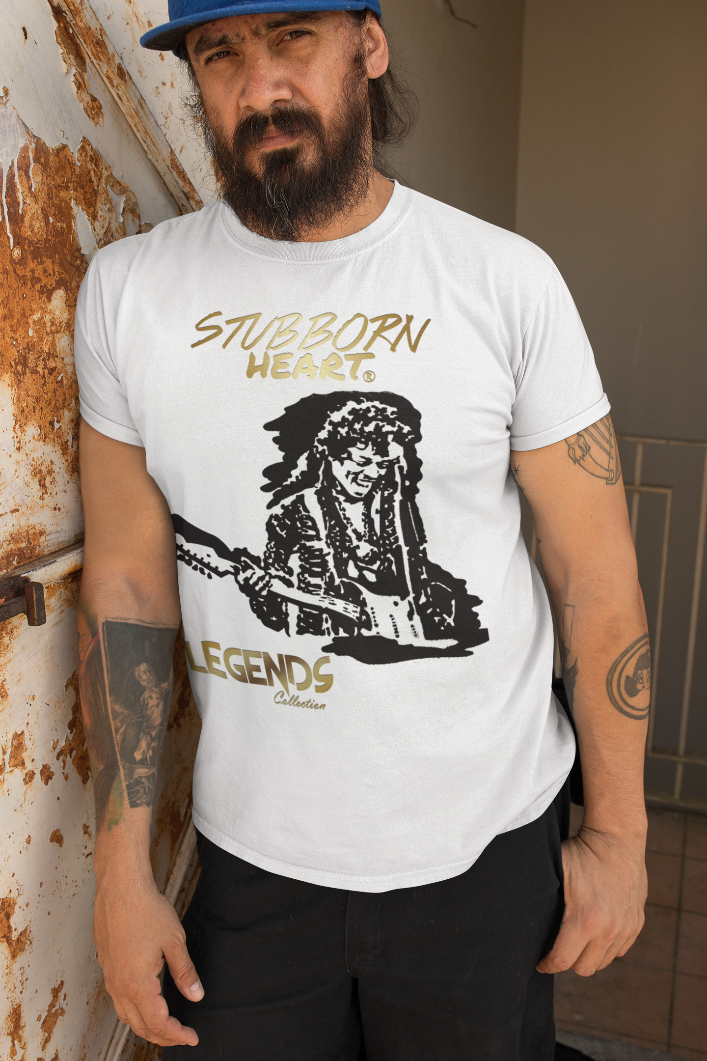 Man with tattoos wearing a STUBBORN HEART Apparel designed tshirt of Jimi Hendrix